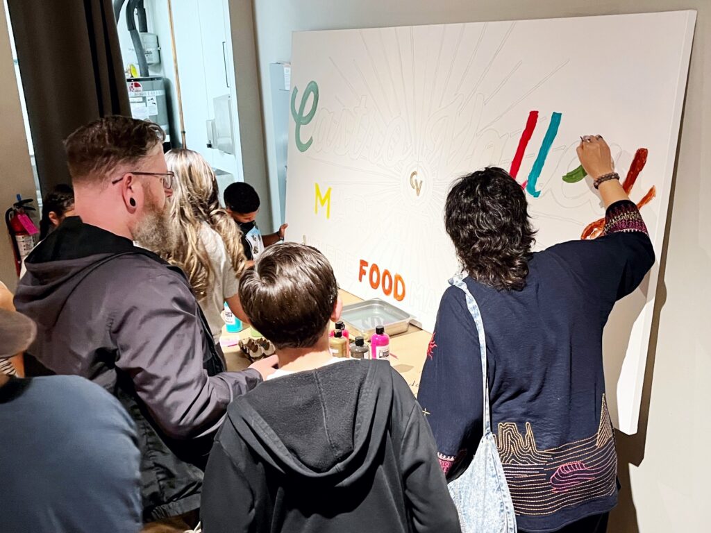 Patrons work on Castro Valley Marketplace Community Art Project